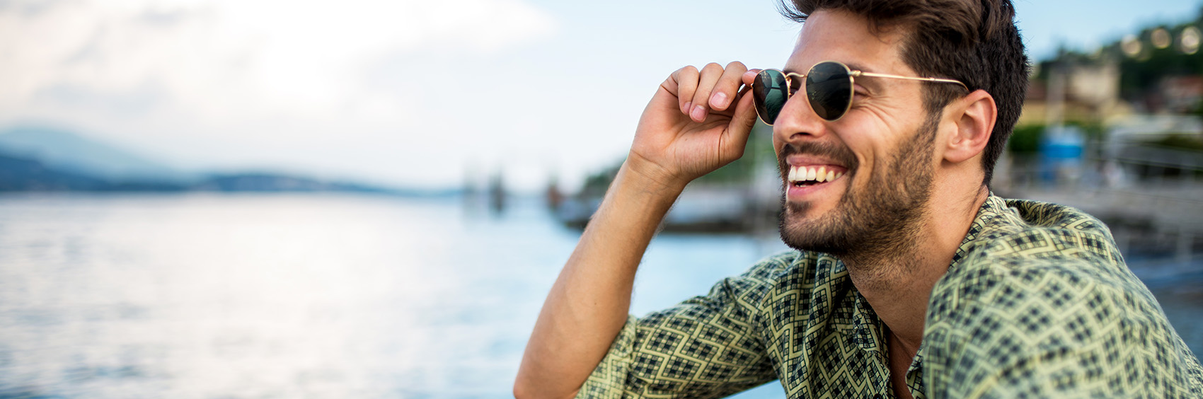 "Man in sunglasses smiling"