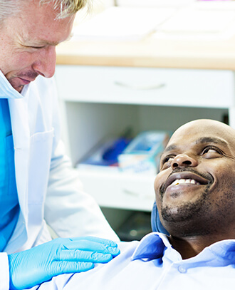 dentist comforting a patient