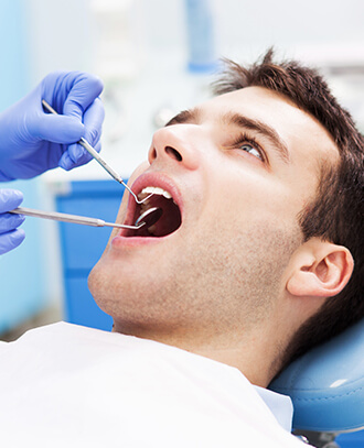 man undergoing a dental exam