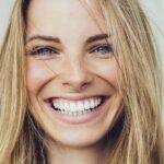 smiling women after professional teeth whitening, prevent stains 48 hours rules